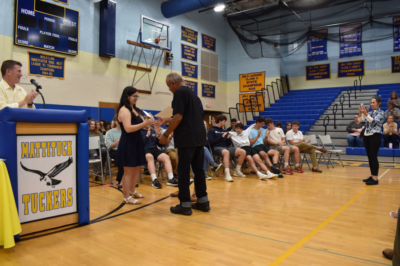 Student Dimitra Pando receiving a scholarship at the Mattituck High School awards ceremony.